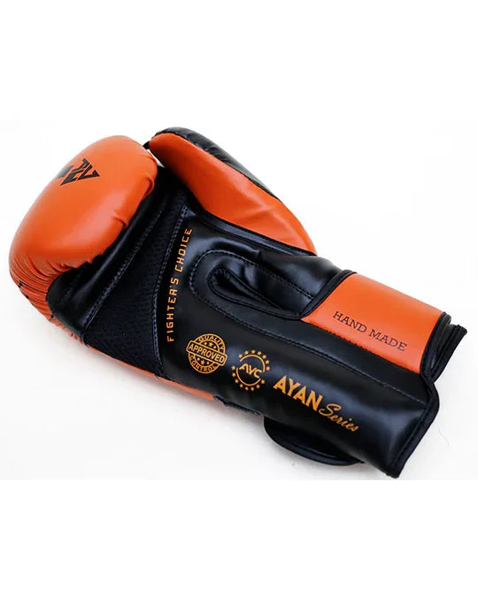 Black and orange handmade boxing glove labeled AYAN Series with sports-related branding.