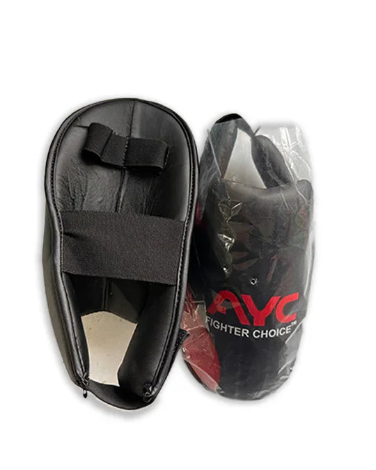 Pair of black martial arts foot guards with elastic straps, one packaged, one unpackaged