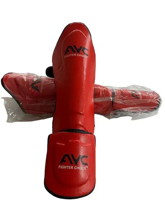 Red shin guards with foot protection, labeled 'Fighter Choice,' for martial arts or kickboxing