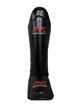 Black martial arts shin guard with red AYC Fighter Choice logo, protective sports gear