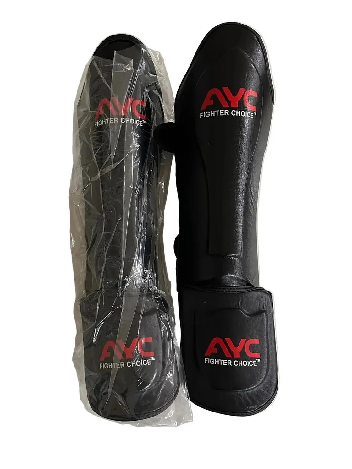 Black shin guards with red AYC Fighter Choice logo, one in packaging, for martial arts protection